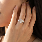 White gold Oval Cut Diamond Three-Stone Ring with Round Side Stones and Pavé Band_125