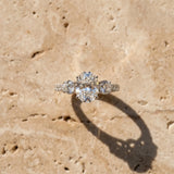 White gold Oval Cut Diamond Three-Stone Ring with Round Side Stones and Pavé Band_126