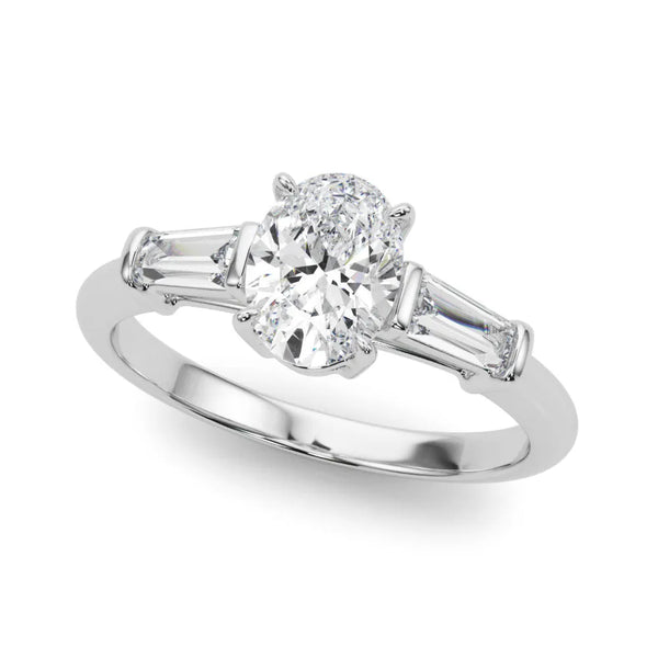 White gold Oval Cut Diamond Three-Stone Ring with Tapered Baguette Side Stones and Prong Setting