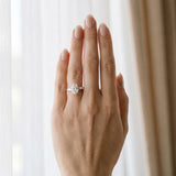 White gold Oval Cut Diamond Three-Stone Ring with Tapered Baguette Side Stones and Prong Setting_27