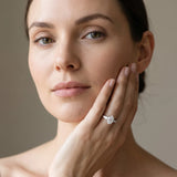 White gold Oval Cut Diamond Three-Stone Ring with Tapered Baguette Side Stones and Prong Setting_28