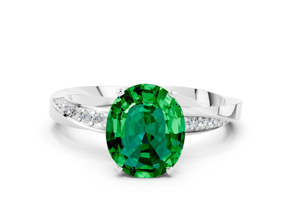 White gold Oval Cut Emerald Engagement Ring with Side Stone Accents and Four-Prong Setting