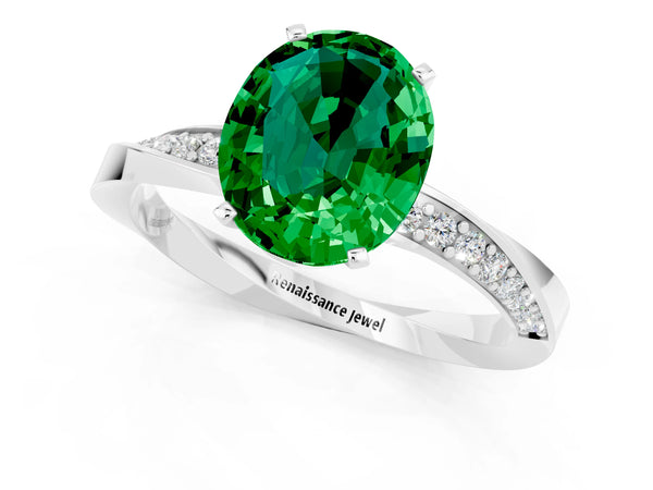 White gold Oval Cut Emerald Engagement Ring with Side Stone Accents and Four-Prong Setting