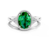 White gold Oval Cut Emerald Halo Ring with Tapered Band and Four-Prong Setting