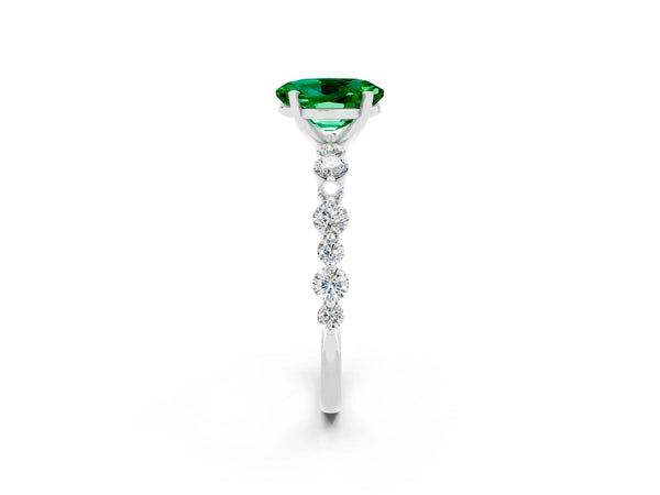 Silver Oval Cut Emerald Prong Set Engagement Ring with Pavé Band