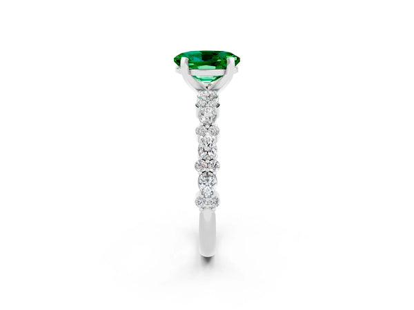 Platinum Oval Cut Emerald Side Stone Solitaire Ring with Round  and Four-Prong Setting