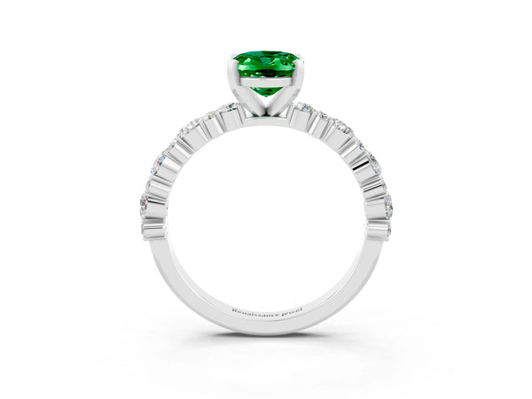 Platinum Oval Cut Emerald Side Stone Solitaire Ring with Round  and Four-Prong Setting