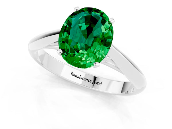 White gold Oval Cut Emerald Solitaire Engagement Ring with Cathedral Setting and Four-Prong Mount