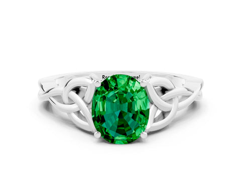 White gold Oval Cut Emerald Solitaire Engagement Ring with Celtic Knot Band and Four-Prong Setting