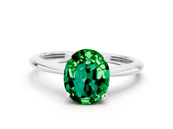 White gold Oval Cut Emerald Solitaire Engagement Ring with Classic Band and Four-Prong Setting