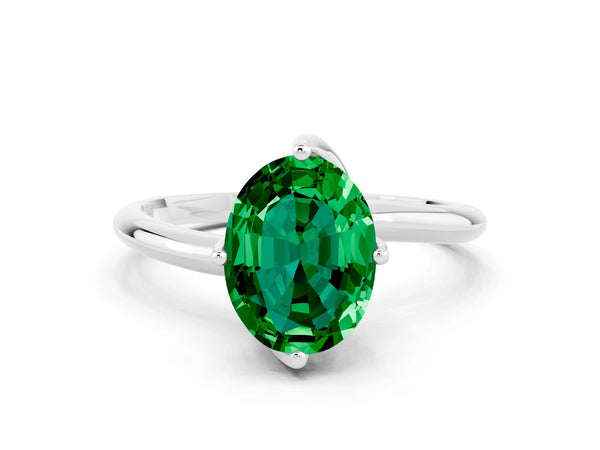 Platinum Oval Cut Emerald Solitaire Engagement Ring with Four-Prong Setting and Classic Band