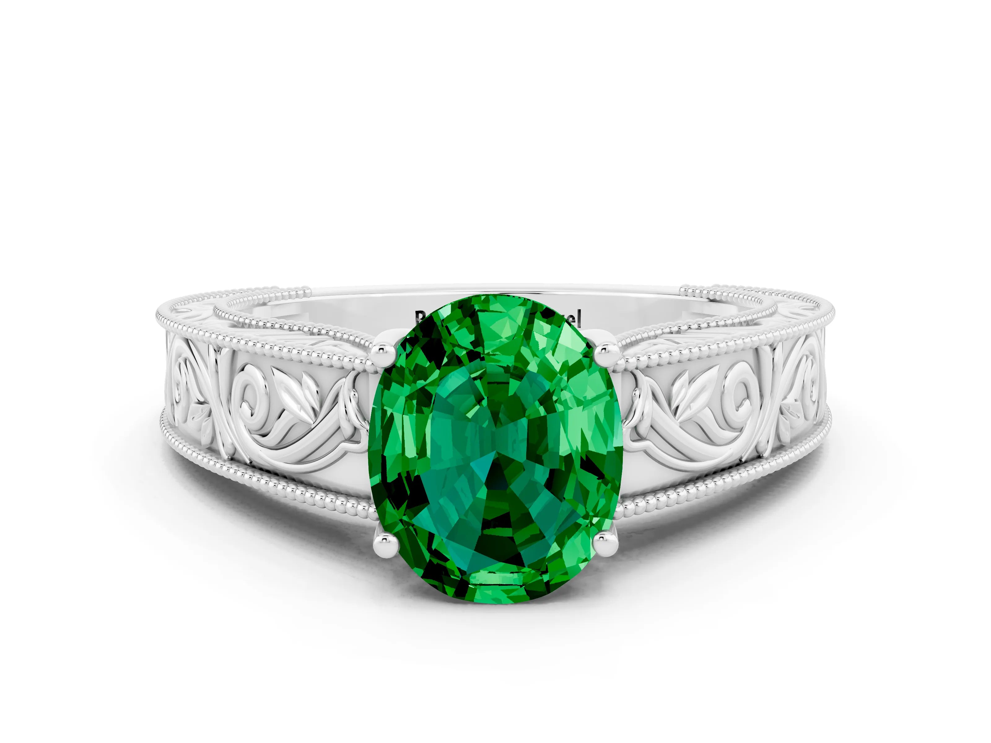 White gold Oval Cut Emerald Solitaire Ring with Engraved Band and Four-Prong Setting