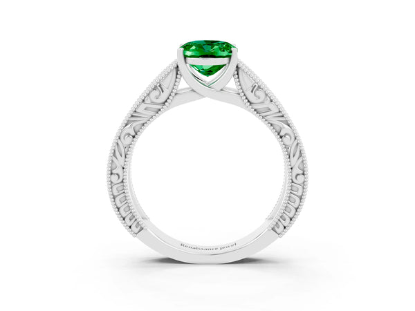 Silver Oval Cut Emerald Solitaire Ring with Engraved Band and Four-Prong Setting