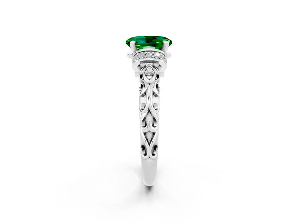 Silver Oval Cut Emerald Solitaire Ring with Filigree Band and Four-Prong Setting
