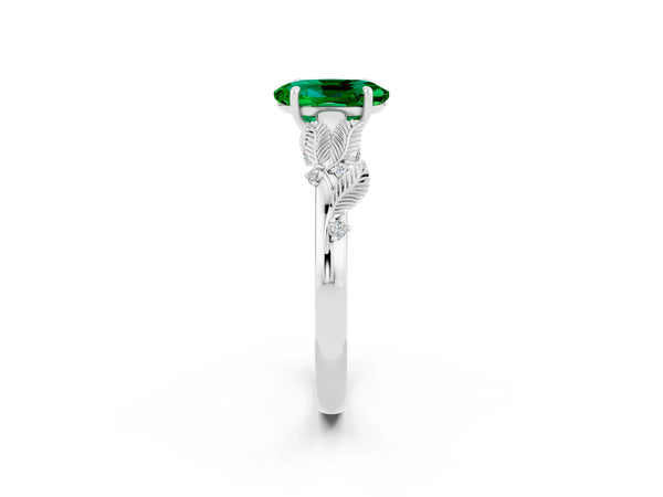 Platinum Oval Cut Emerald Solitaire Ring with Leaf Motif Band and Four-Prong Setting