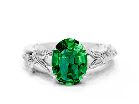 White gold Oval Cut Emerald Solitaire Ring with Leaf Motif Band and Four-Prong Setting