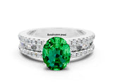 White gold Oval Cut Emerald Solitaire Ring with Pavé and Channel Set Band