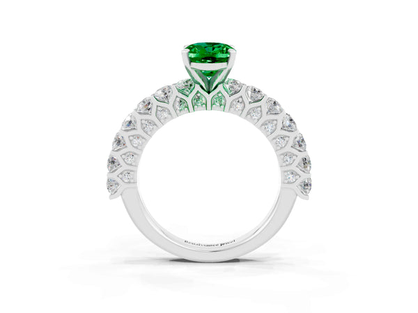 Platinum Oval Cut Emerald Solitaire Ring with Shared Prong Pavé Band and Four-Prong Setting