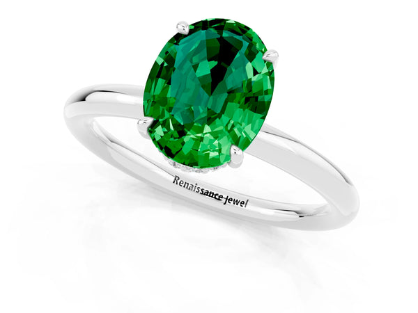 Platinum Oval Cut Emerald Solitaire Ring with Thin Band and Four-Prong Setting