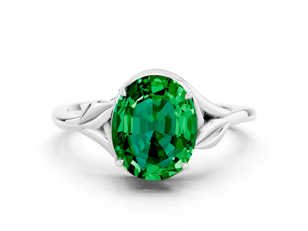 Platinum Oval Cut Emerald Solitaire Ring with Twist Band and Four-Prong Setting