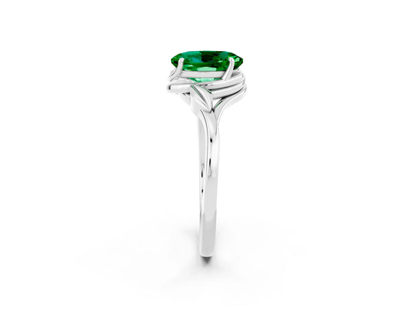 White gold Oval Cut Emerald Solitaire Ring with Twist Band and Four-Prong Setting