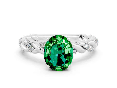 White gold Oval Cut Emerald Solitaire Ring with Twisted Band and Pavé Accents