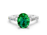 White gold Oval Cut Emerald Solitaire with Side Baguettes and Channel Set Band