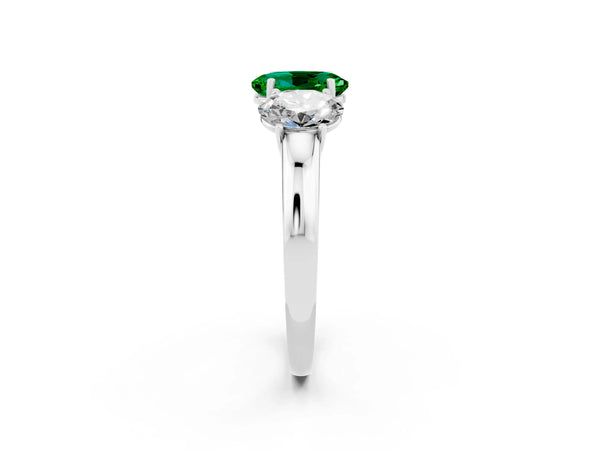Platinum Oval Cut Emerald Three-Stone Ring with Four-Prong Setting and Classic Band