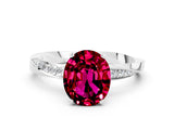 White gold Oval Cut Garnet Engagement Ring with Side Stone Accents and Four-Prong Setting_24