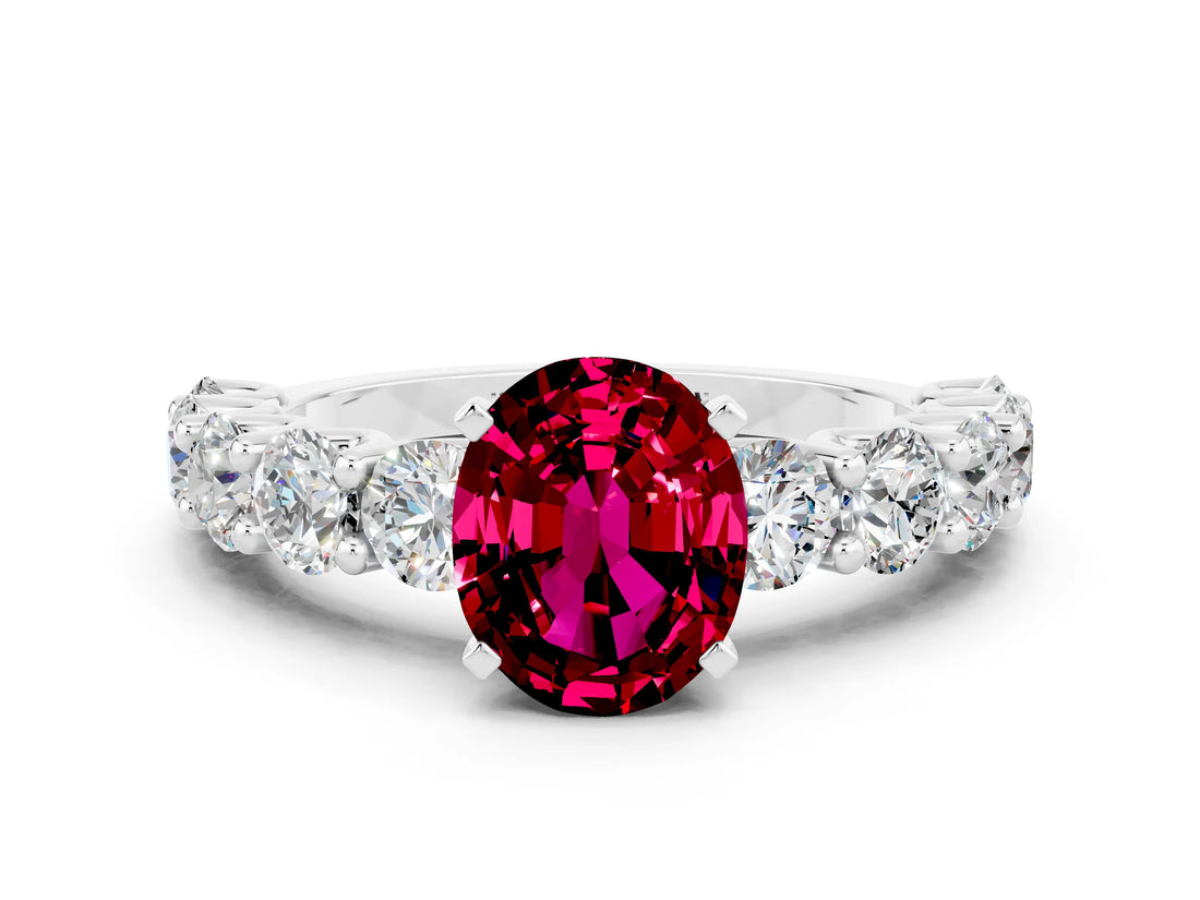 White gold Oval Cut Garnet Prong Setting with Side Stones on a Pave Band