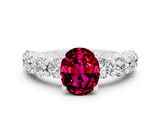 White gold Oval Cut Garnet Prong Setting with Side Stones on a Pave Band