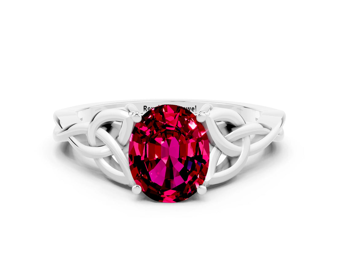 White gold Oval Cut Garnet Solitaire Engagement Ring with Celtic Knot Band and Four-Prong Setting