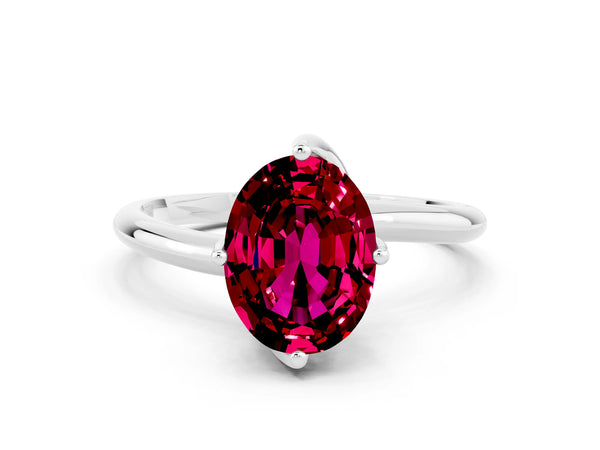 Silver Oval Cut Garnet Solitaire Engagement Ring with Four-Prong Setting and Classic Band