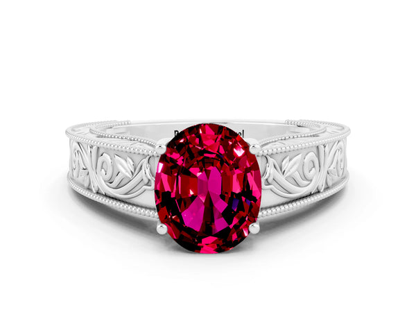Platinum Oval Cut Garnet Solitaire Ring with Engraved Band and Four-Prong Setting
