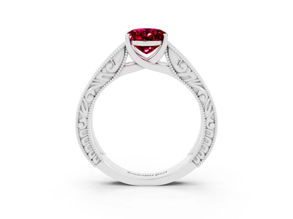 White gold Oval Cut Garnet Solitaire Ring with Engraved Band and Four-Prong Setting