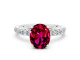 White gold Oval Cut Garnet Solitaire Ring with Pavé Accents and Four-Prong Setting