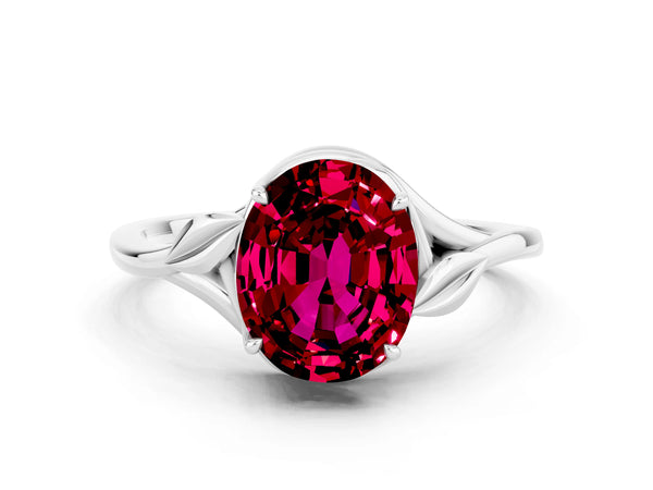Silver Oval Cut Garnet Solitaire Ring with Twist Band and Four-Prong Setting