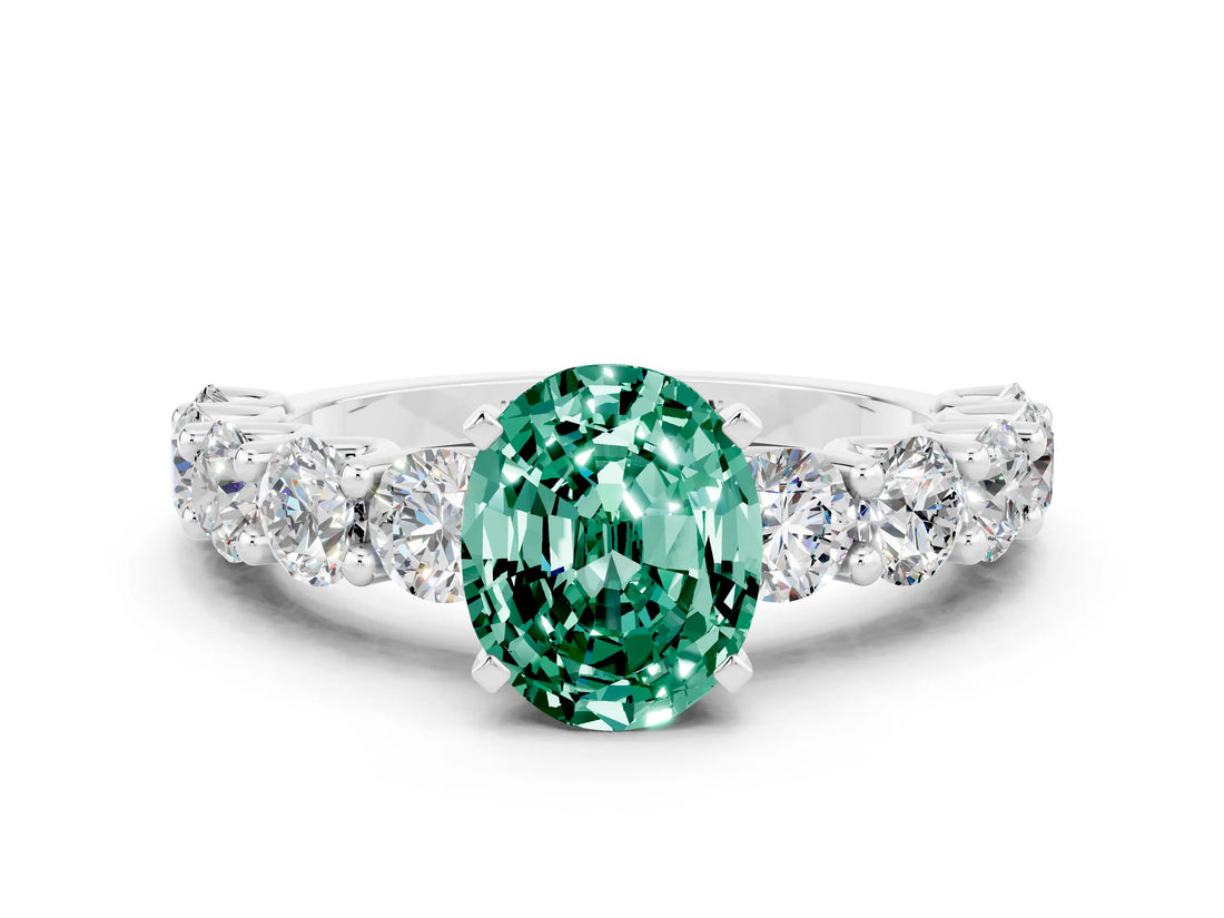 White gold Oval Cut Green Sapphire Prong Setting with Side Stones on a Pave Band