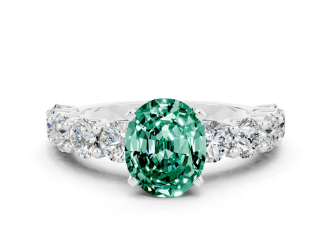 White gold Oval Cut Green Sapphire Prong Setting with Side Stones on a Pave Band