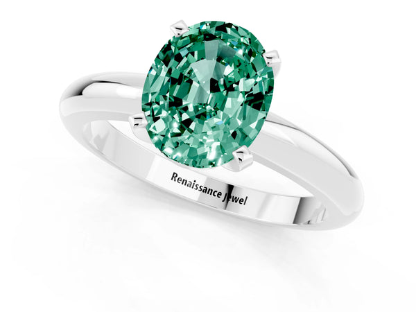 Platinum Oval Cut Green Sapphire Solitaire Engagement Ring with Round Band and Four-Prong Setting