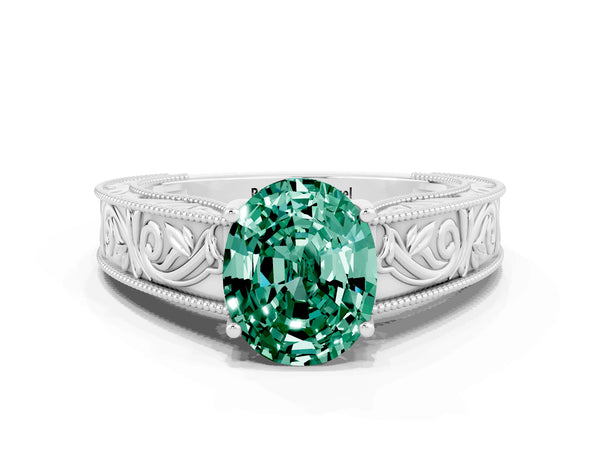 White gold Oval Cut Green Sapphire Solitaire Ring with Engraved Band and Four-Prong Setting