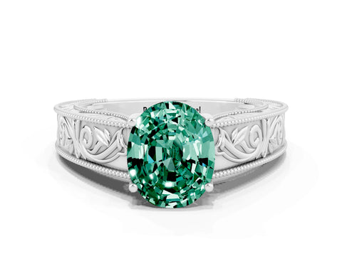 White gold Oval Cut Green Sapphire Solitaire Ring with Engraved Band and Four-Prong Setting