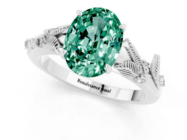 Platinum Oval Cut Green Sapphire Solitaire Ring with Leaf Motif Band and Four-Prong Setting