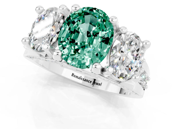 White gold Oval Cut Green Sapphire Three-Stone Ring with Channel Set Band and Four-Prong Setting