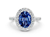 White gold Oval Cut Halo Diamond Ring with Pavé Band and Three-Prong Setting