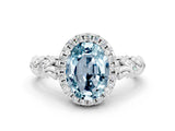 White gold Oval Cut Halo Diamond Solitaire with Filigree Band and Four-Prong Setting