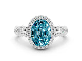 White gold Oval Cut Halo Diamond Solitaire with Filigree Band and Four-Prong Setting