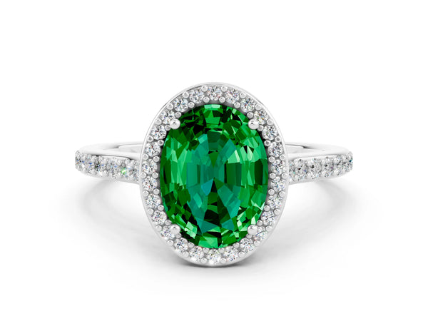 Silver Oval Cut Emerald Halo Engagement Ring with Round Pavé Shoulders and Prong Setting