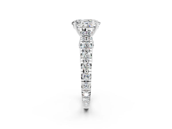 Platinum Oval Cut Moissanite Classic Solitaire Ring with Pavé Band and Four-Prong Setting