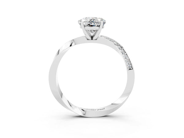 Silver Oval Cut Moissanite Engagement Ring with Side Stone Accents and Four-Prong Setting